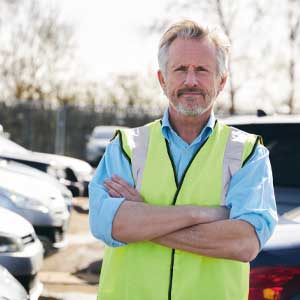 A man wearing a hi-vis vest